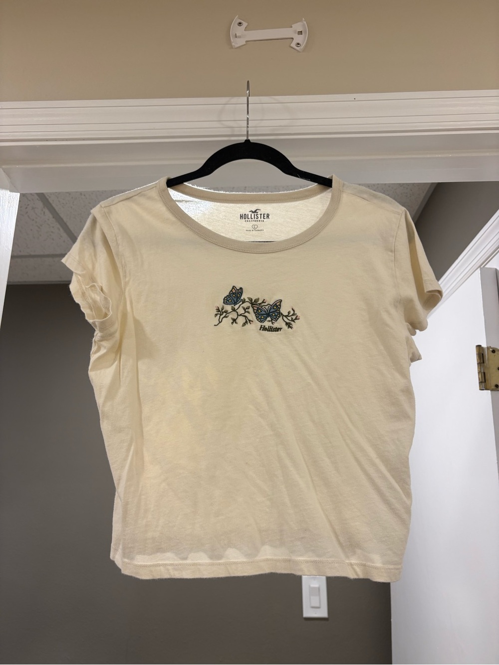 Hollister Cream Tee with Blue Butterfly Embroidery